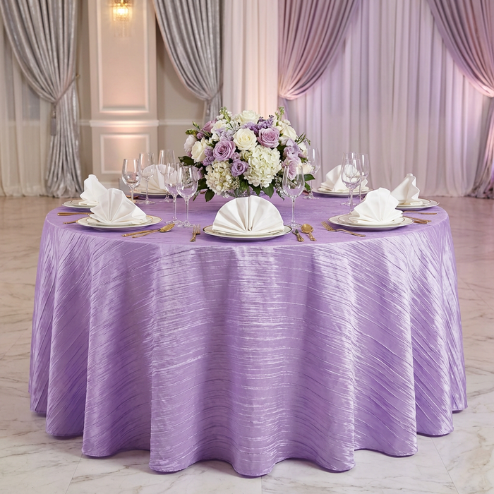 Accordion Crinkle Taffeta Round Tablecloth Lavender on a round table with ivory napkins in a fan fold