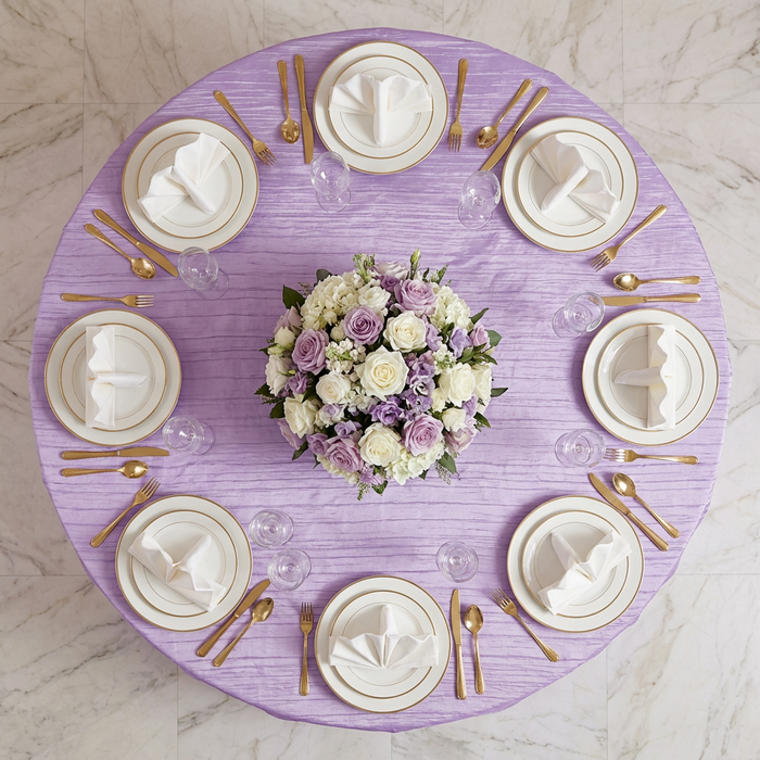 birds eye view of the Accordion Crinkle Taffeta Round Tablecloth Lavender on a round with white gold trimmed dinner plates and water glasses