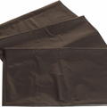 A stack of black disposable waste vacuum bags.