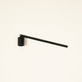Matte black candle snuffer.