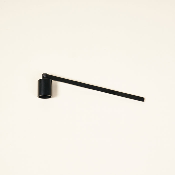 Matte black candle snuffer.