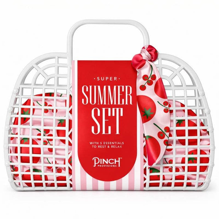 Pinch Provisions Super Summer Set in white wicker basket with red cherry design and pink bow