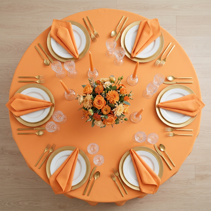 Premium Polyester 120" Round Tablecloth - Orange | charger plate | napkin | dinner plate | wine goblets |