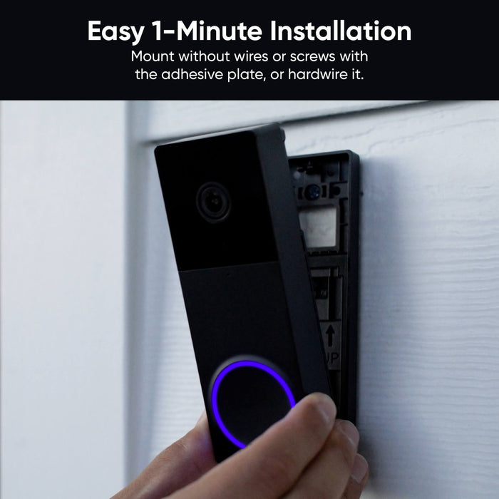A person is installing a Wyze Duo Cam Battery Doorbell.
