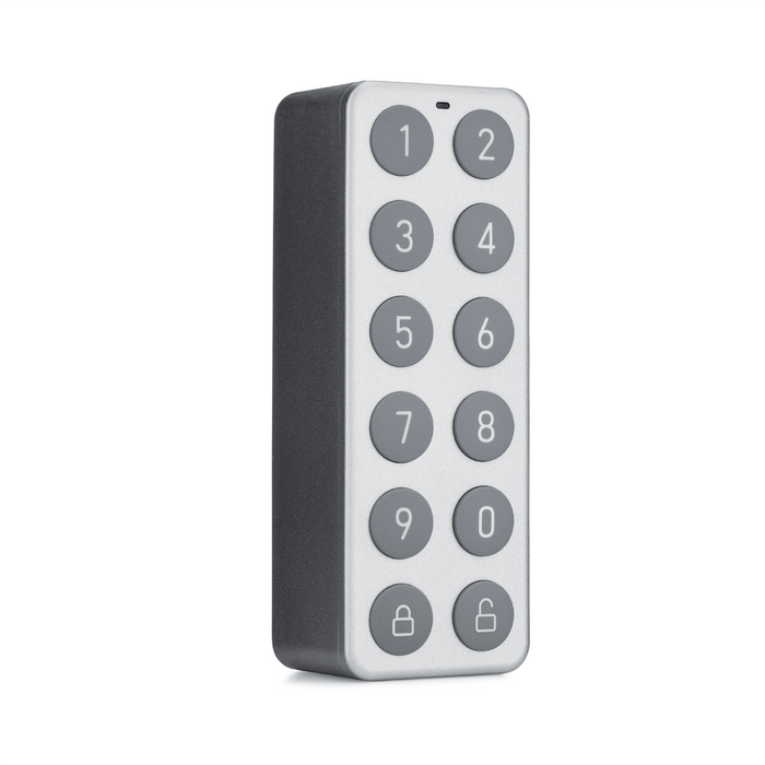 A gray and white keypad for a lock.