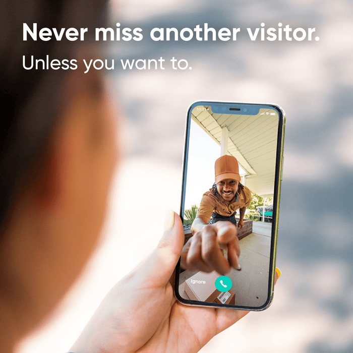A person holding a cell phone with a picture of a man on it.