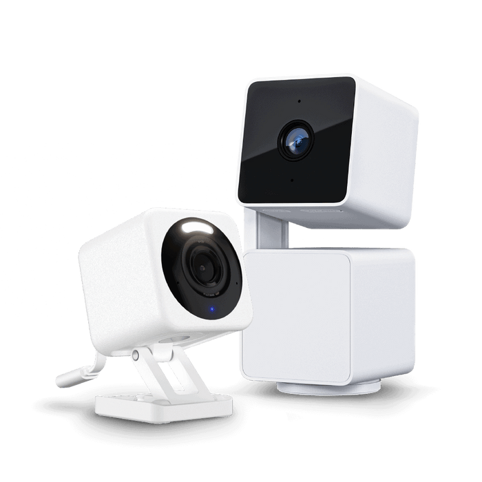 A white security camera with a blue lens.