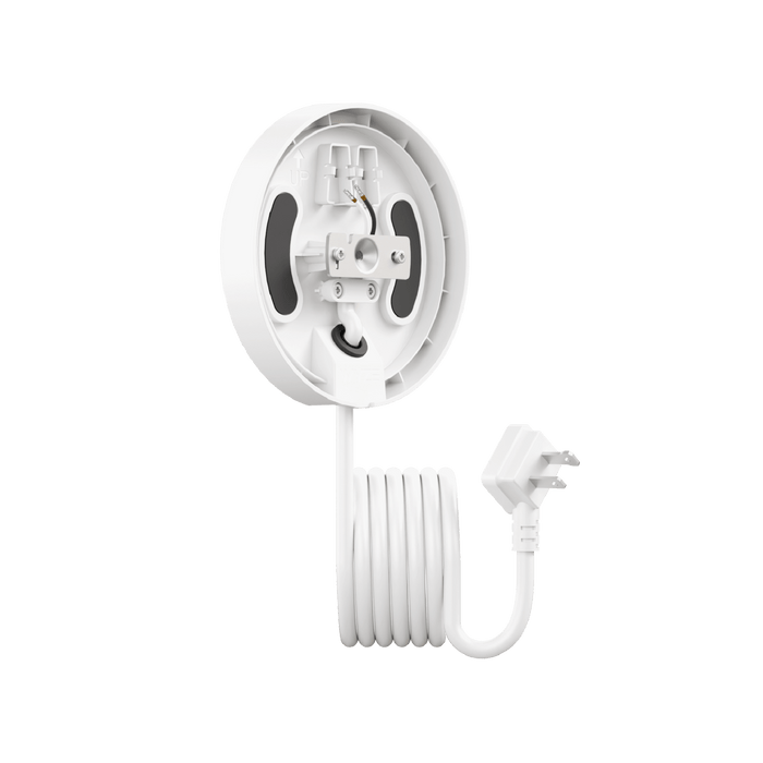 A white camera with a green background.