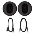 A black headphone with a black cord.