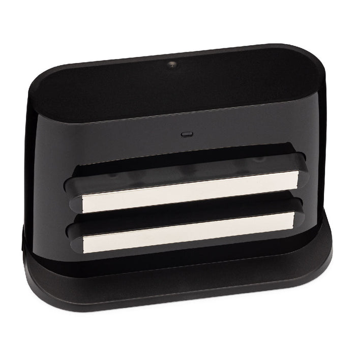 A black charging station for a robot vacuum.