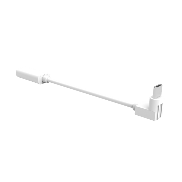 A white cord plugged into a solar panel, which extends battery life for the Wyze Battery Cam Pro.